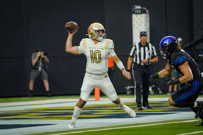 Notre Dame Fighting Irish quarterback Drew Pyne (10) throws a pass against the Brigham Young Cougars during the first half at Allegiant Stadium.
